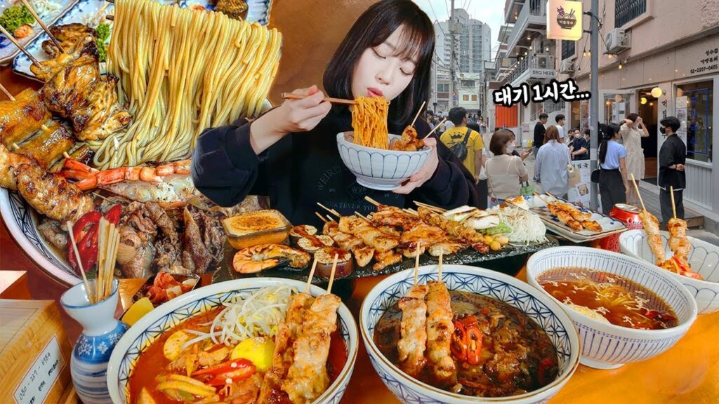 korean youtuber Tzuyang doing mukbang source photo: https://www.google.com/url?sa=i&url=https%3A%2F%2Fm.youtube.com%2Fwatch%3Fv%3D1xtDsmbE91k&psig=AOvVaw3prOOFw0slgYy6WM7DgfGH&ust=1710431644129000&source=images&cd=vfe&opi=89978449&ved=0CBMQjRxqFwoTCOitnMfM8YQDFQAAAAAdAAAAABAE